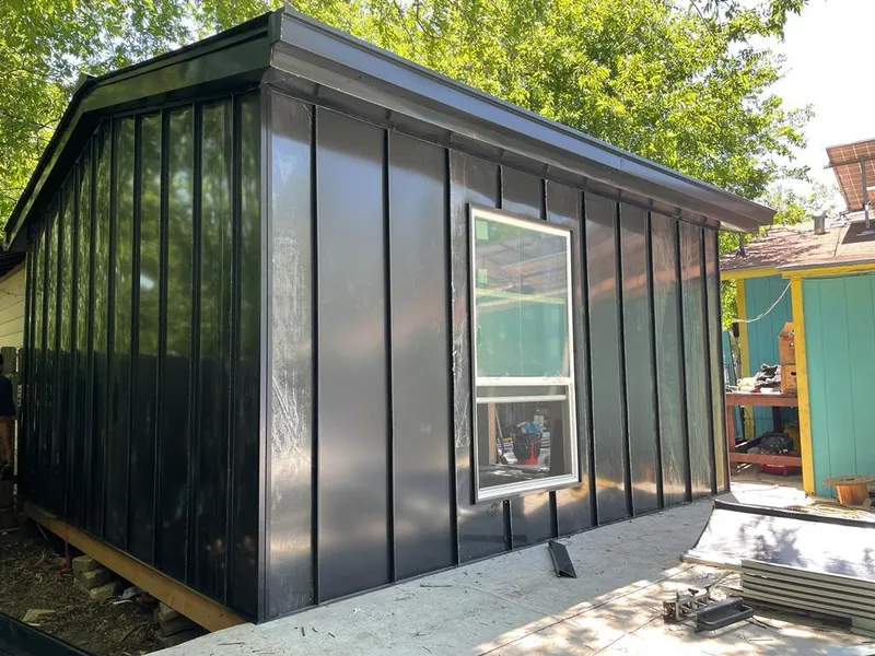 Black standing seam metal wall panels for Roof Inspection in Fort Carson